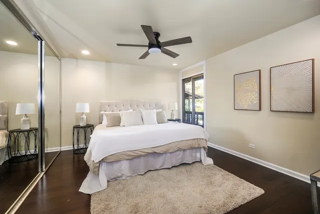 a bedroom with a bed and a night stand