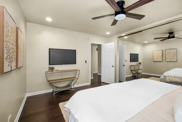 a room with a bed and a flat screen tv