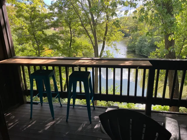 a view of a two chairs in the balcony