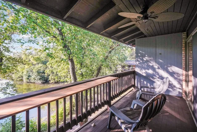 a view of balcony with wooden floor