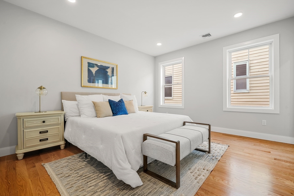 60 Fuller Street, Unit PH5 Boston, MA 02124 - Photo 13 of 32 a bedroom with a bed and a window