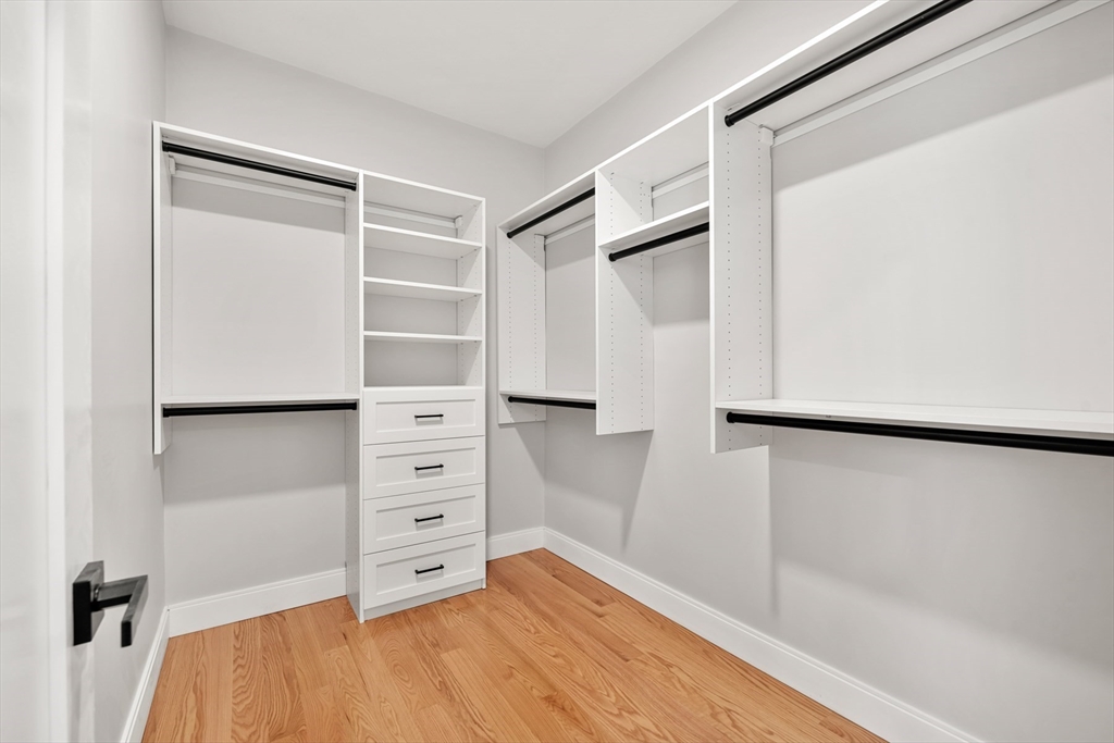 60 Fuller Street, Unit PH5 Boston, MA 02124 - Photo 15 of 32 a view of walk in closet with empty racks