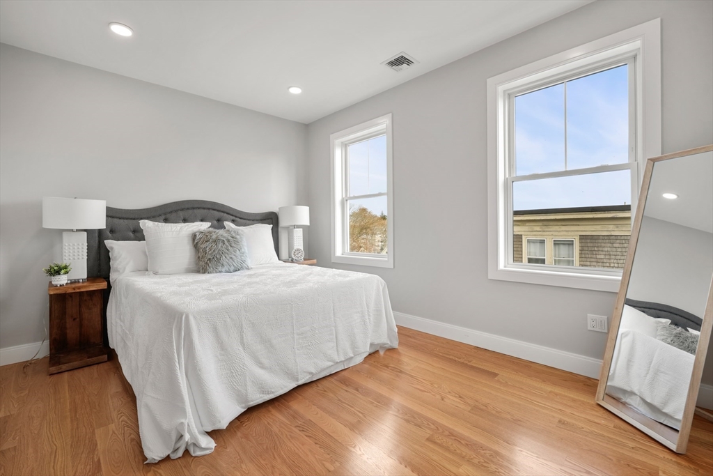 60 Fuller Street, Unit PH5 Boston, MA 02124 - Photo 19 of 32 a bedroom with a bed and a window