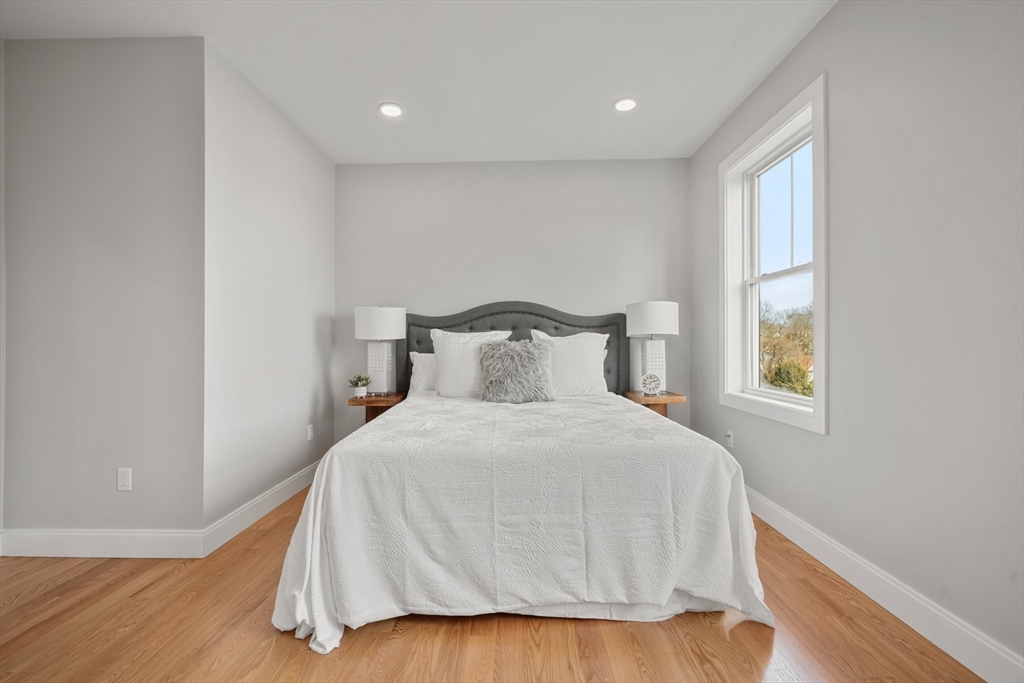 60 Fuller Street, Unit PH5 Boston, MA 02124 - Photo 21 of 32 a bedroom with a bed and a window