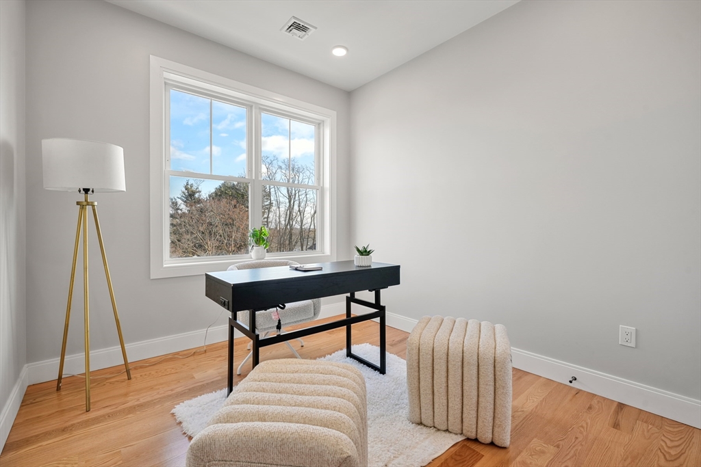 60 Fuller Street, Unit PH5 Boston, MA 02124 - Photo 22 of 32 a living room with furniture a rug and a window