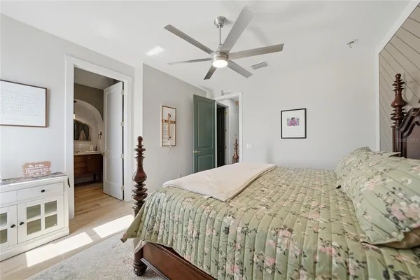 a spacious bathroom with a granite countertop sink and a mirror