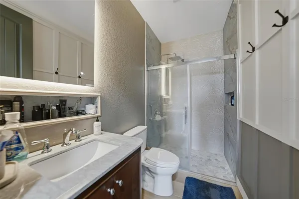 a bedroom with a bed and a couch