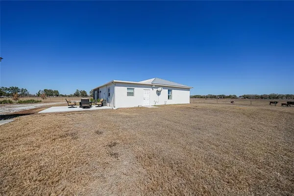 a view of a lake with beach and city view