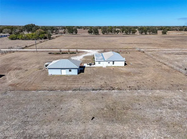 a view of a terrace with yard