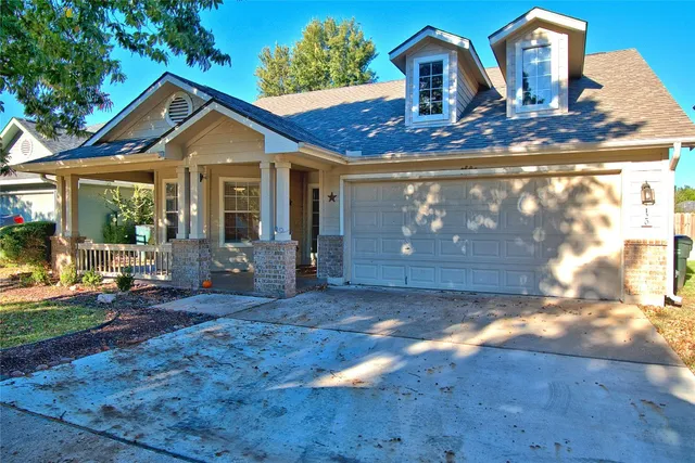 a front view of a house with yard