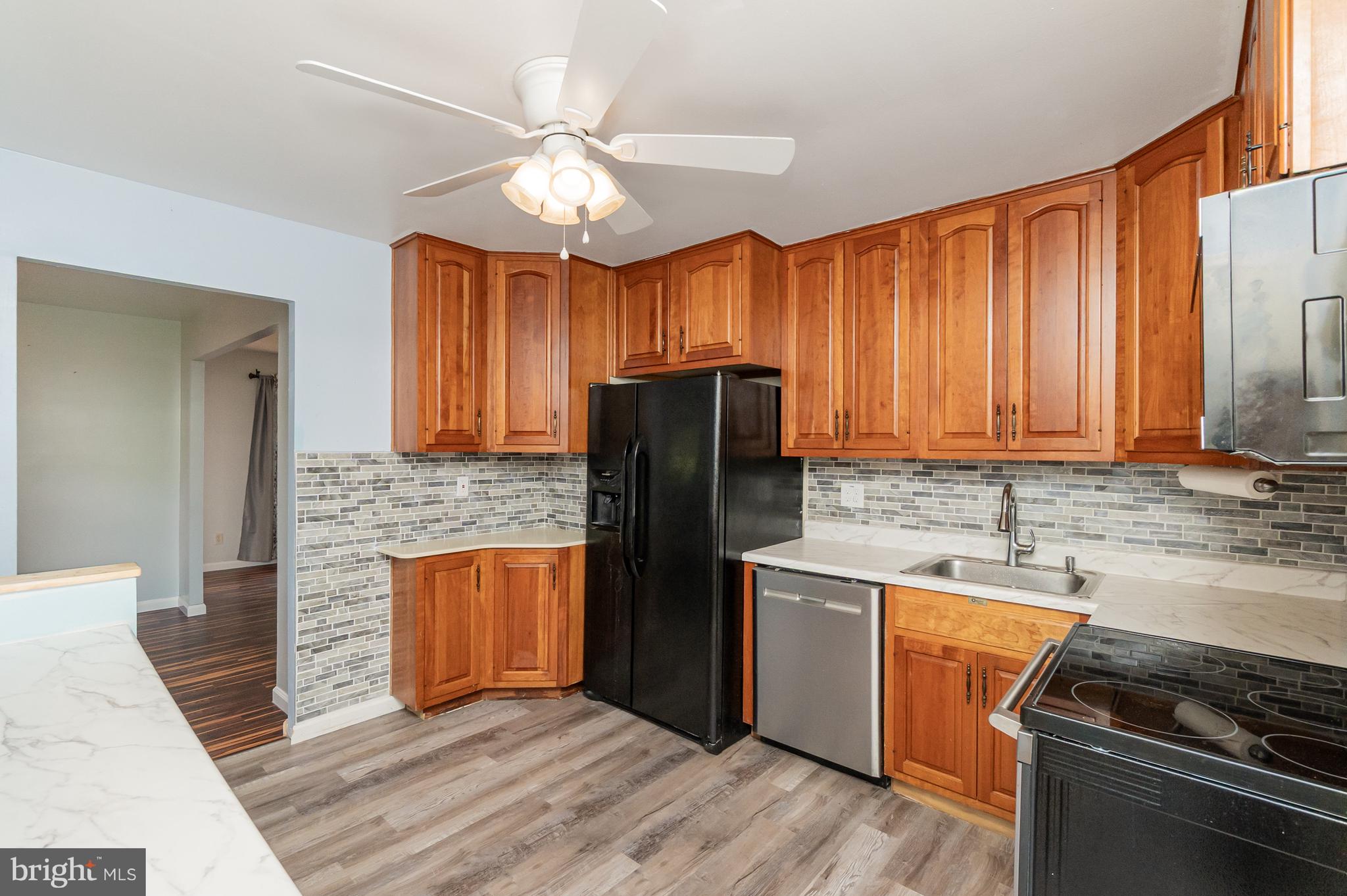 107 Jarmon Road Elkton, MD 21921 - Photo 11 of 33 a kitchen with stainless steel appliances granite countertop a refrigerator stove and sink