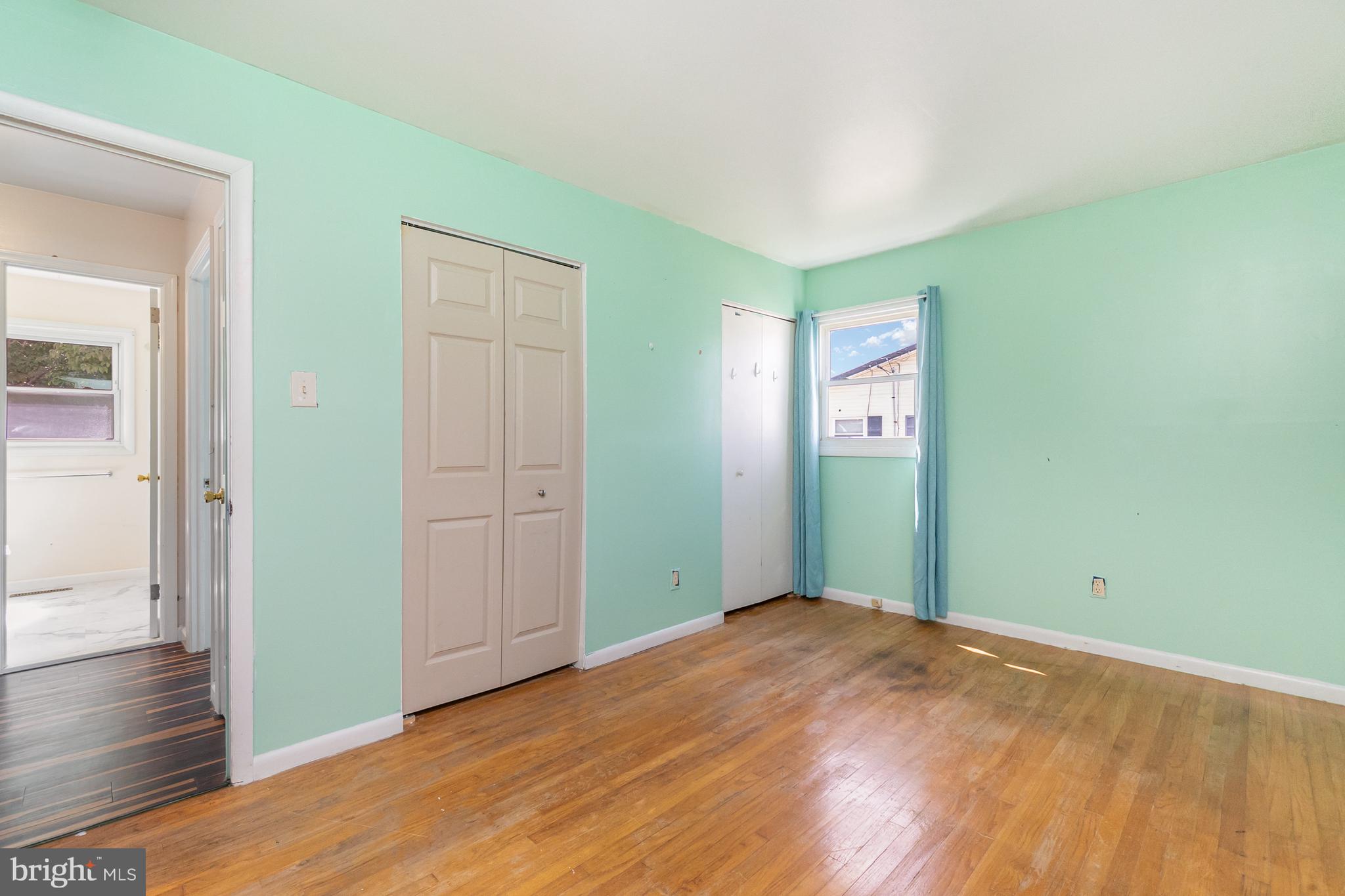 107 Jarmon Road Elkton, MD 21921 - Photo 17 of 33 an empty room with wooden floor closet and windows