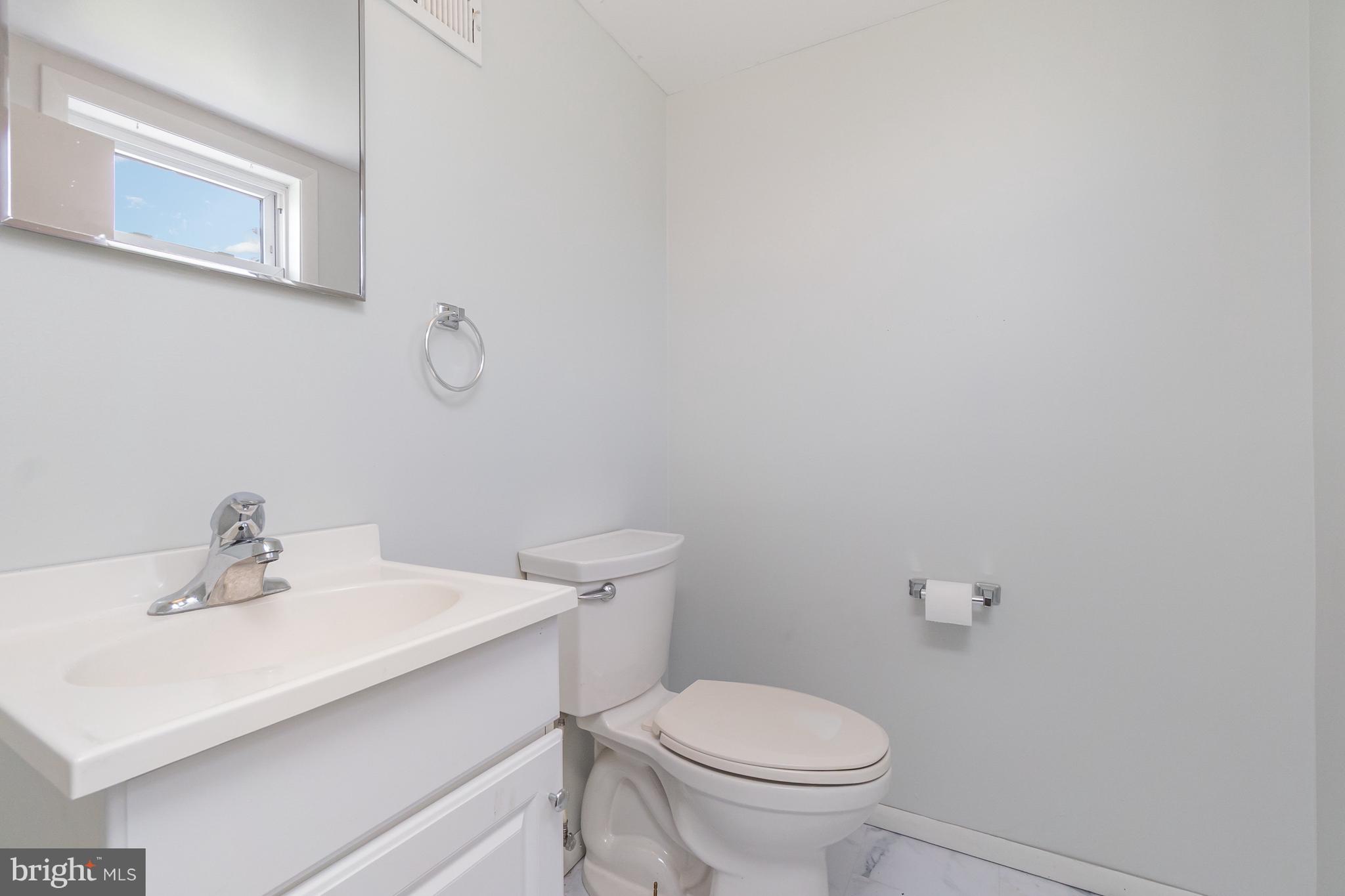 107 Jarmon Road Elkton, MD 21921 - Photo 28 of 33 a bathroom with a sink a toilet and mirror