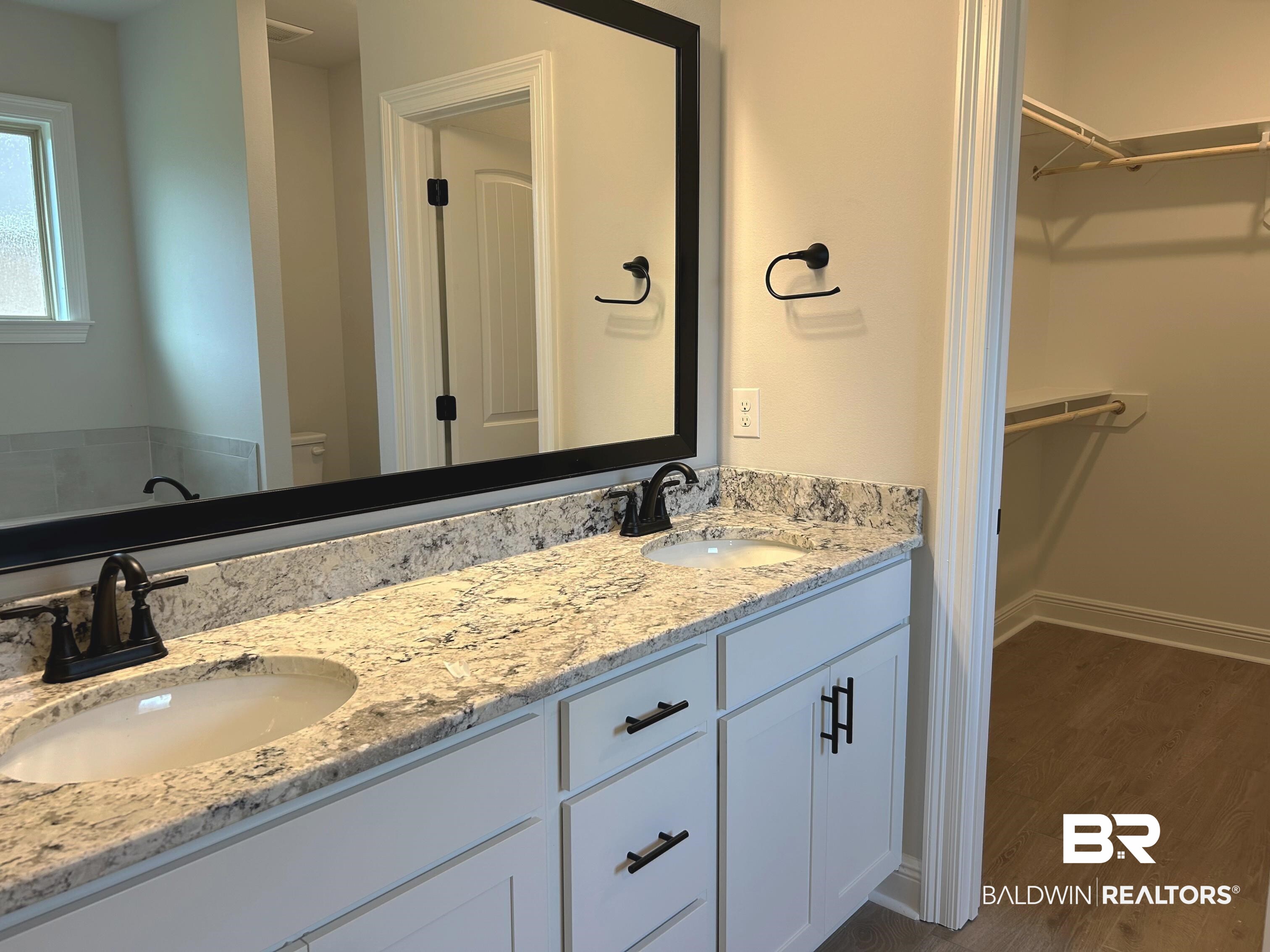 860 Sumter Loop Foley, AL 36535 - Photo 14 of 26 Bathroom featuring wood-type flooring and vanity