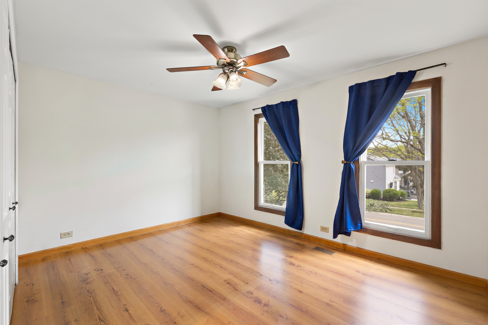 506 Old Hunt Road Fox River Grove, IL 60021 - Photo 22 of 44 a view of an empty room with wooden floor and a window