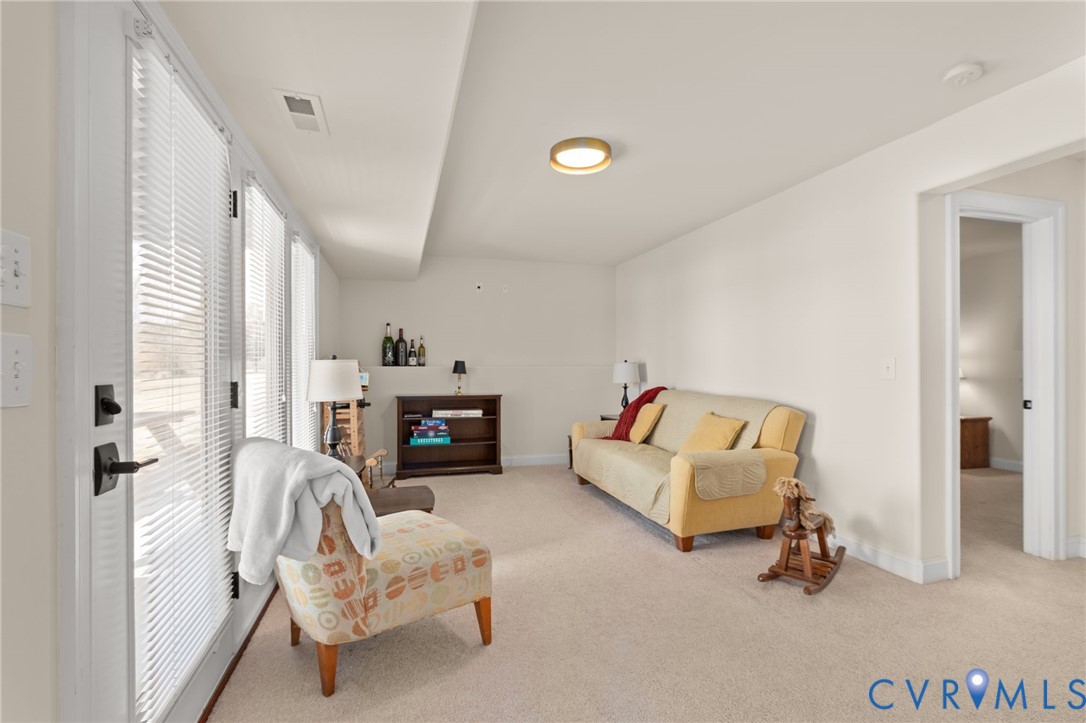 175 Shellfield Lane Colonial Beach, VA 22443 - Photo 49 of 100 Living area with light carpet and baseboards