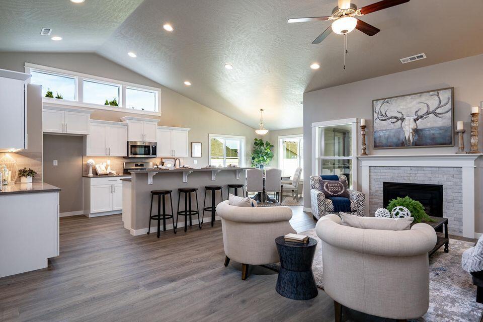 56275 Black Duck Road Bend, OR 97707 - Photo 3 of 15 a living room with furniture fireplace and kitchen view