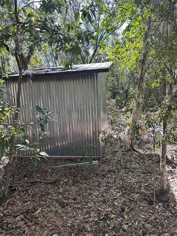a view of backyard with green space
