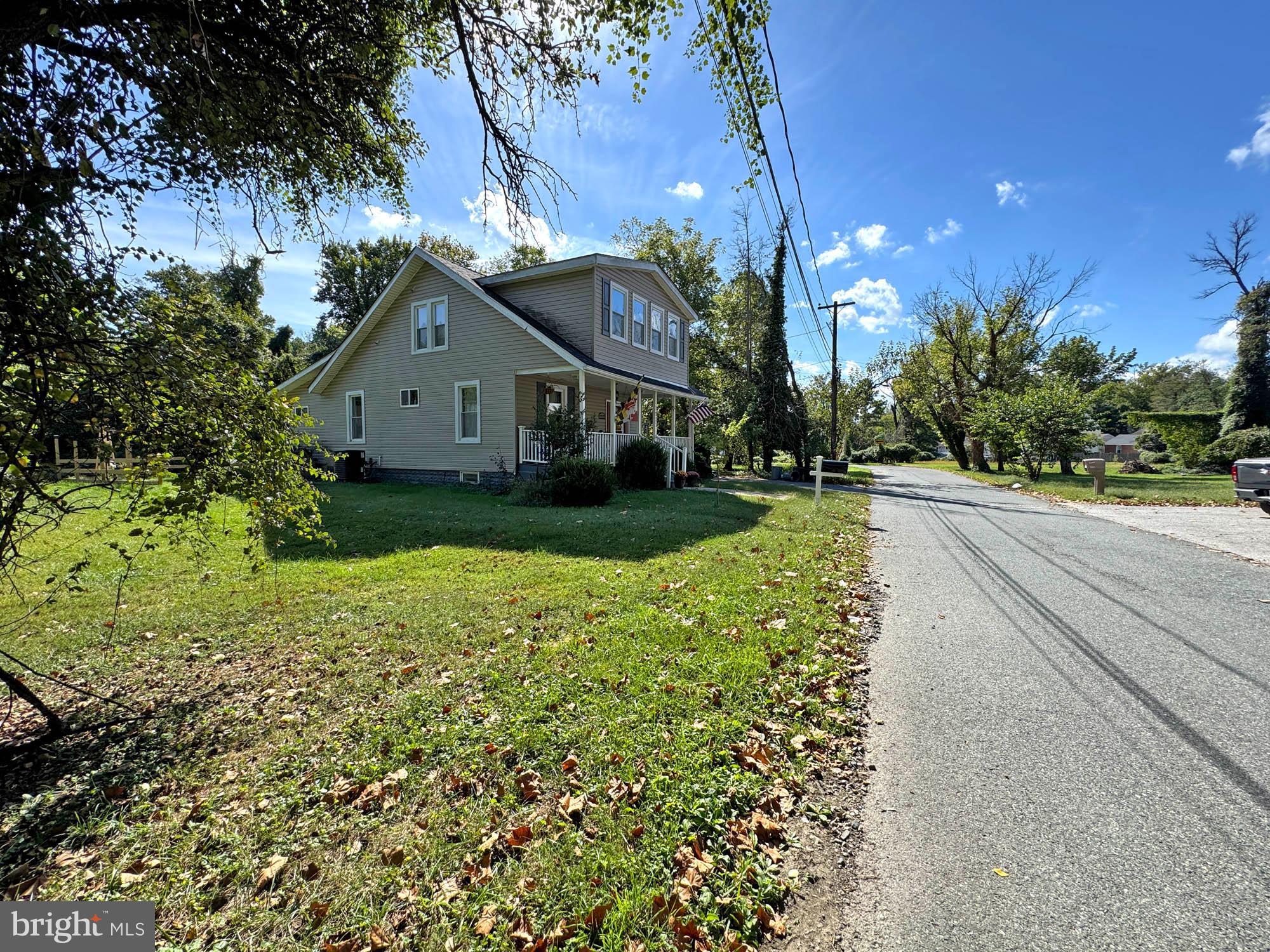 Hannah Avenue Baltimore, MD 21227 - Photo 5 of 5 a front view of a house with a garden