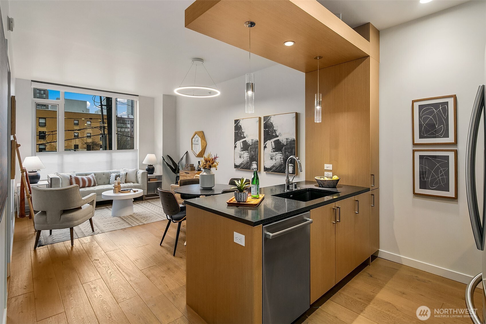a view of a living room and kitchen