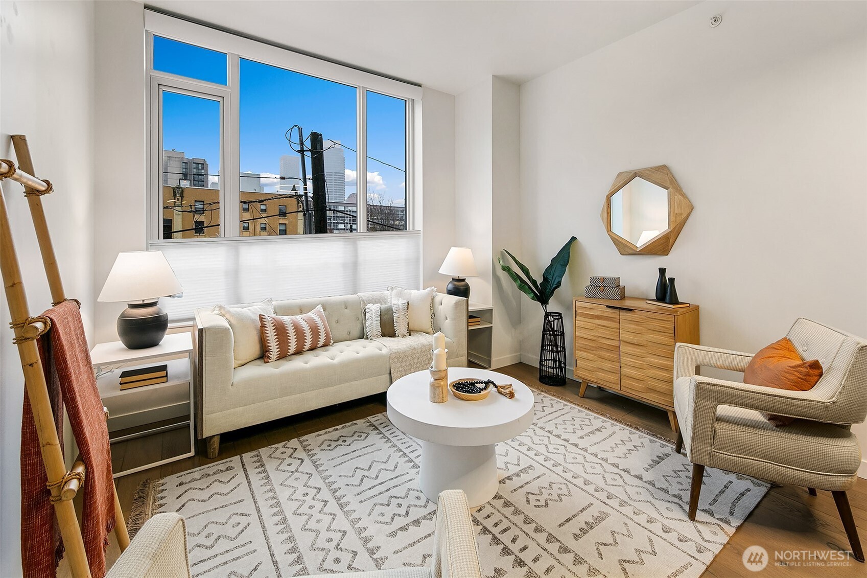 1321 Seneca Street, Unit 206 Seattle, WA 98101 - Photo 13 of 35 a living room with furniture and a mirror
