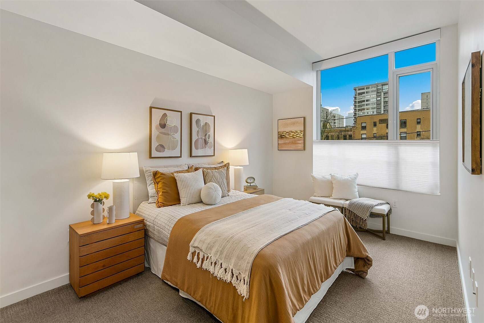 1321 Seneca Street, Unit 206 Seattle, WA 98101 - Photo 15 of 35 a bed room with a bed and a night stand