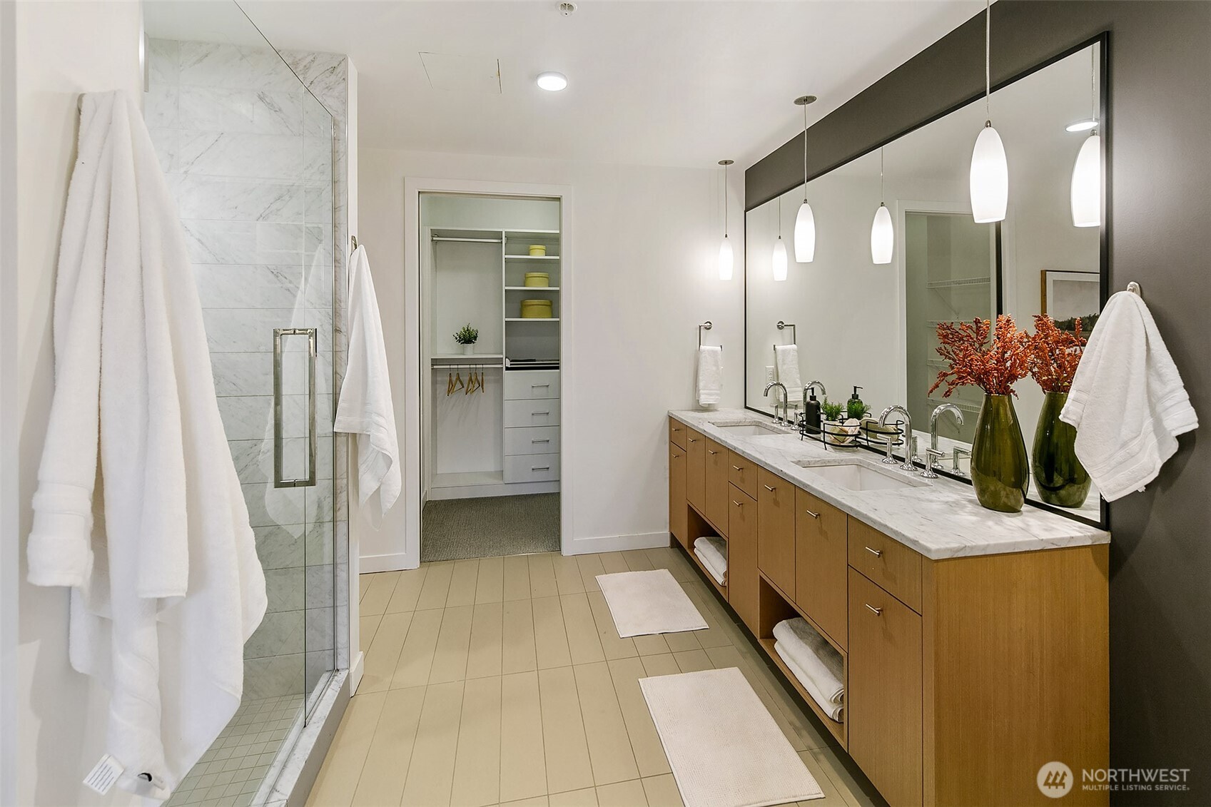 1321 Seneca Street, Unit 206 Seattle, WA 98101 - Photo 17 of 35 a bathroom with a double vanity sink and mirror
