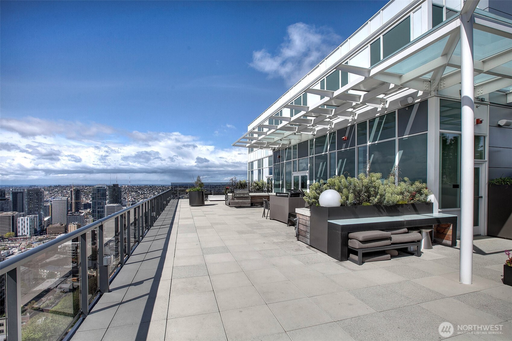 1321 Seneca Street, Unit 206 Seattle, WA 98101 - Photo 24 of 35 a view of a chairs and tables in the balcony