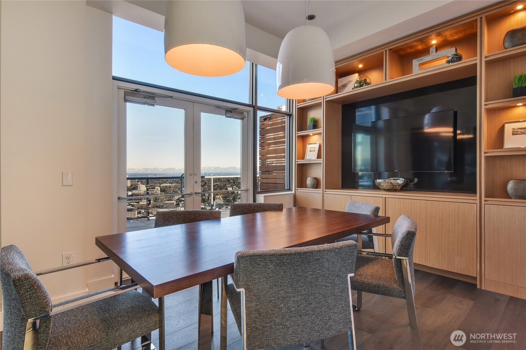 1321 Seneca Street, Unit 206 Seattle, WA 98101 - Photo 33 of 35 a kitchen with a dining table chairs and chandelier