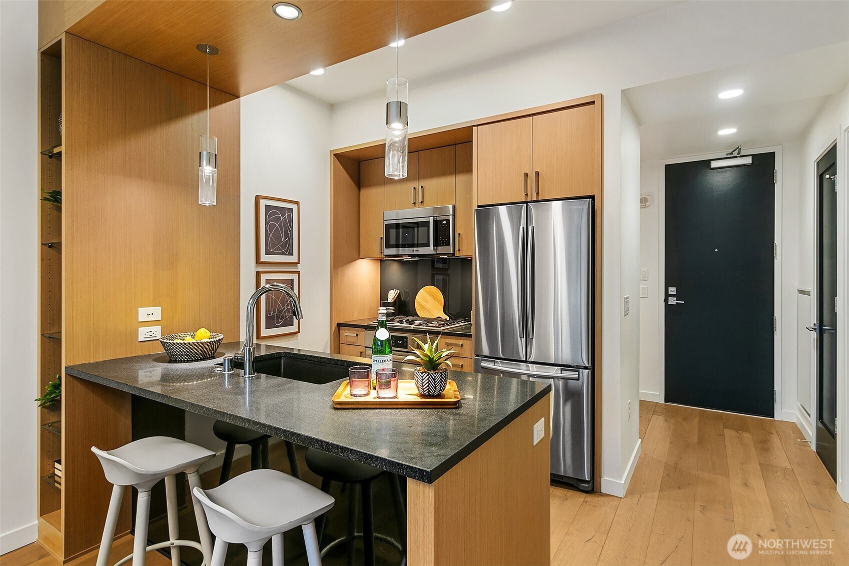 1321 Seneca Street, Unit 206 Seattle, WA 98101 - Photo 6 of 35 a kitchen with stainless steel appliances a sink and a refrigerator