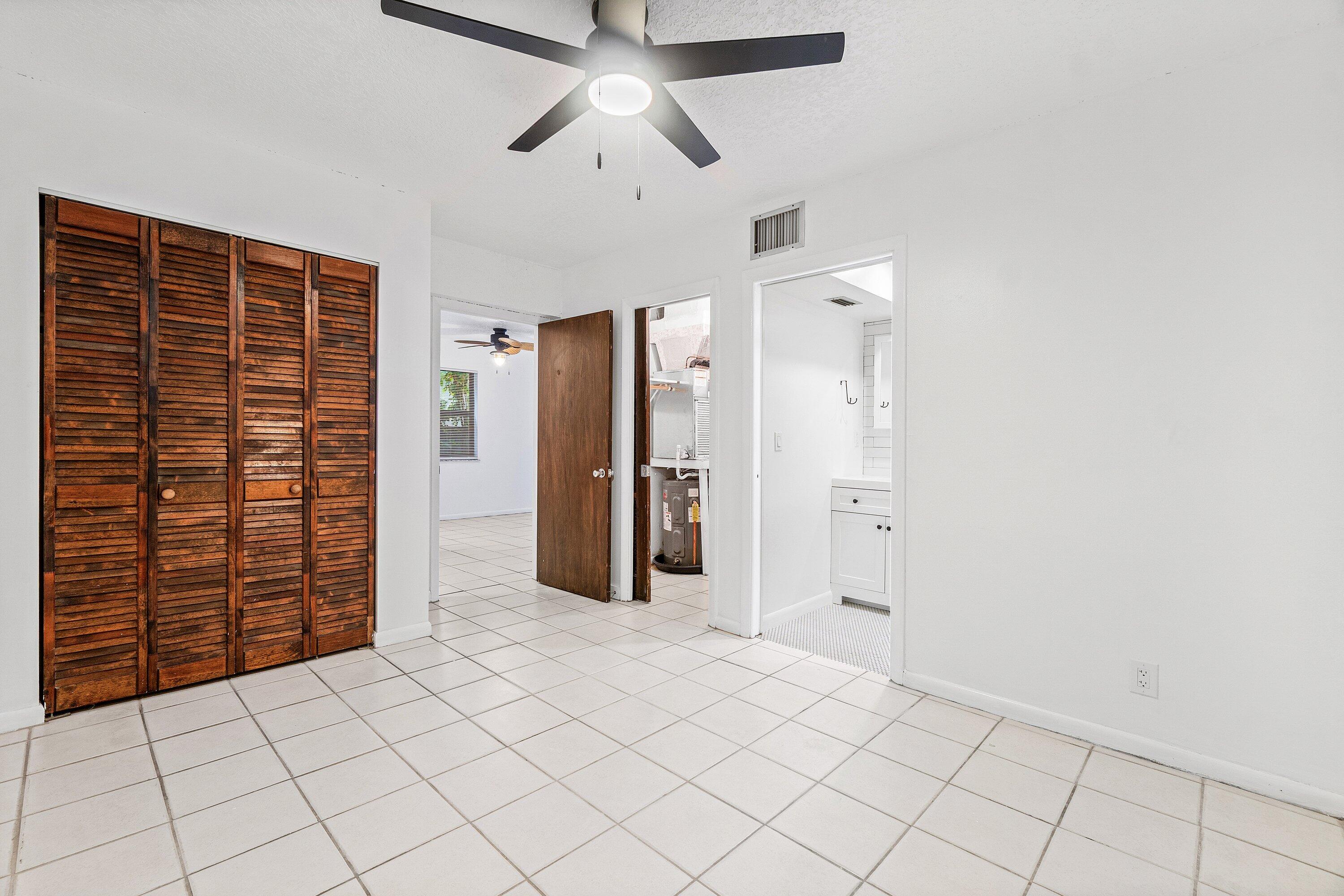 626 North Federal Highway, Unit 3 Lake Worth Beach, FL 33460 - Photo 13 of 23 a view of empty room with cabinet and ceiling fan