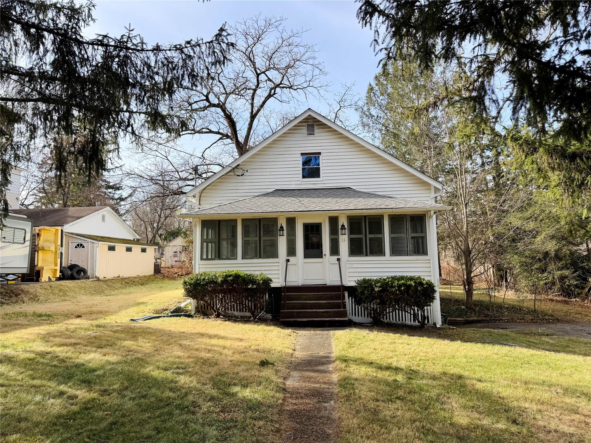 13 Lango Road Amenia, NY 12501 - Photo 1 of 1 View of front of house with a sunroom and a front yard