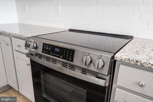 a close up of a stove sitting inside of a kitchen