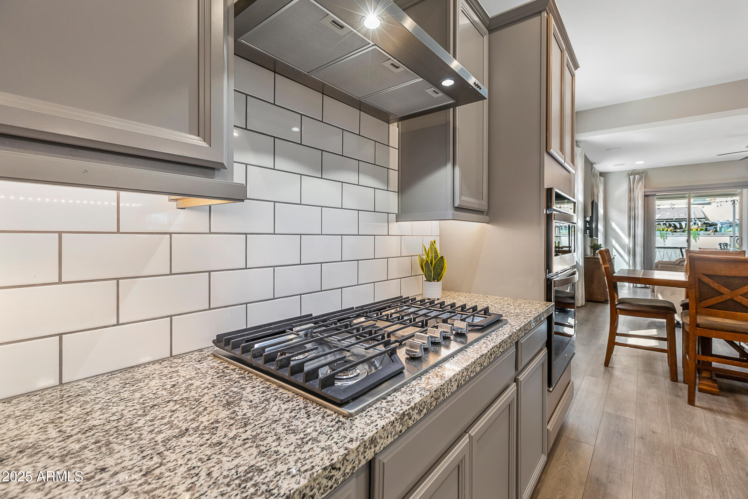 23030 East Estrella Road Queen Creek, AZ 85142 - Photo 13 of 47 a stove top oven sitting inside of a kitchen