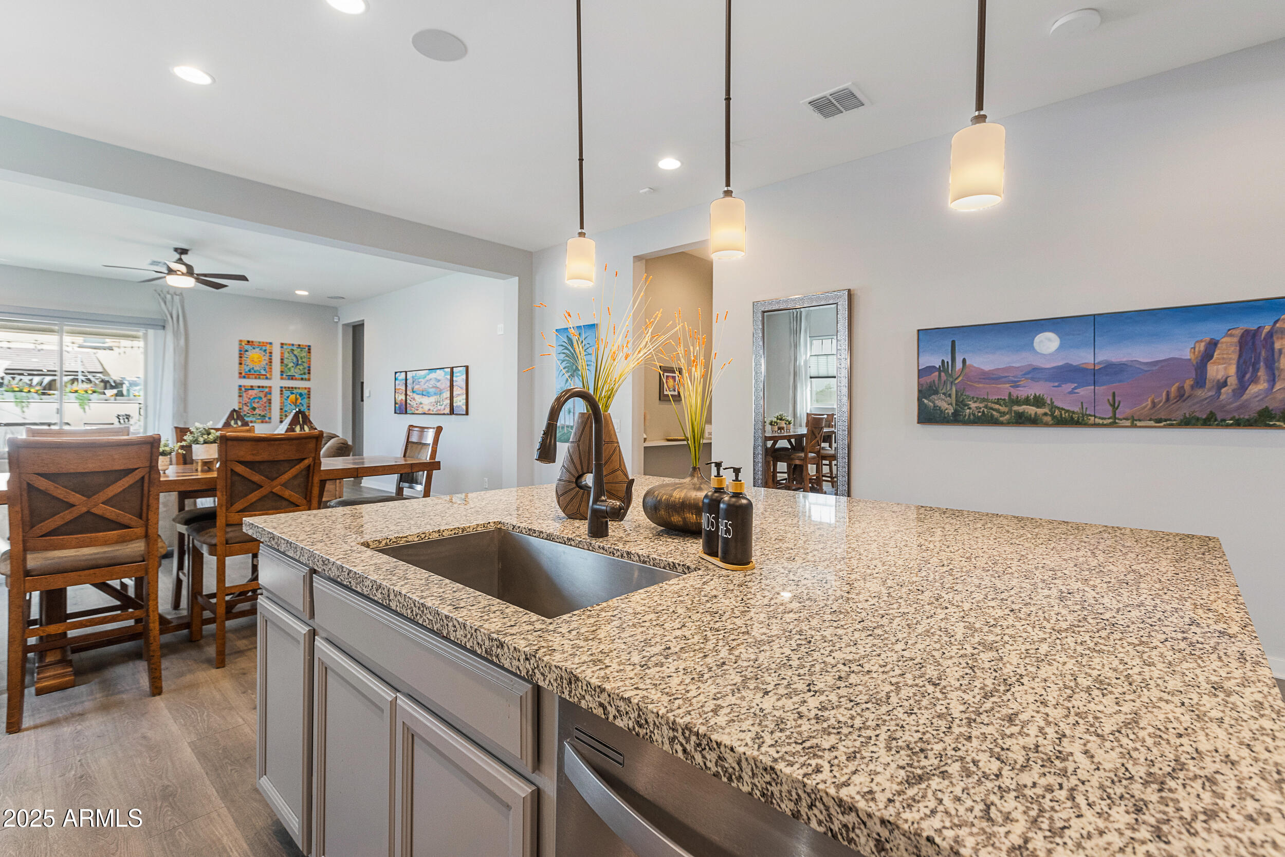 23030 East Estrella Road Queen Creek, AZ 85142 - Photo 14 of 47 a kitchen with sink and view of living room