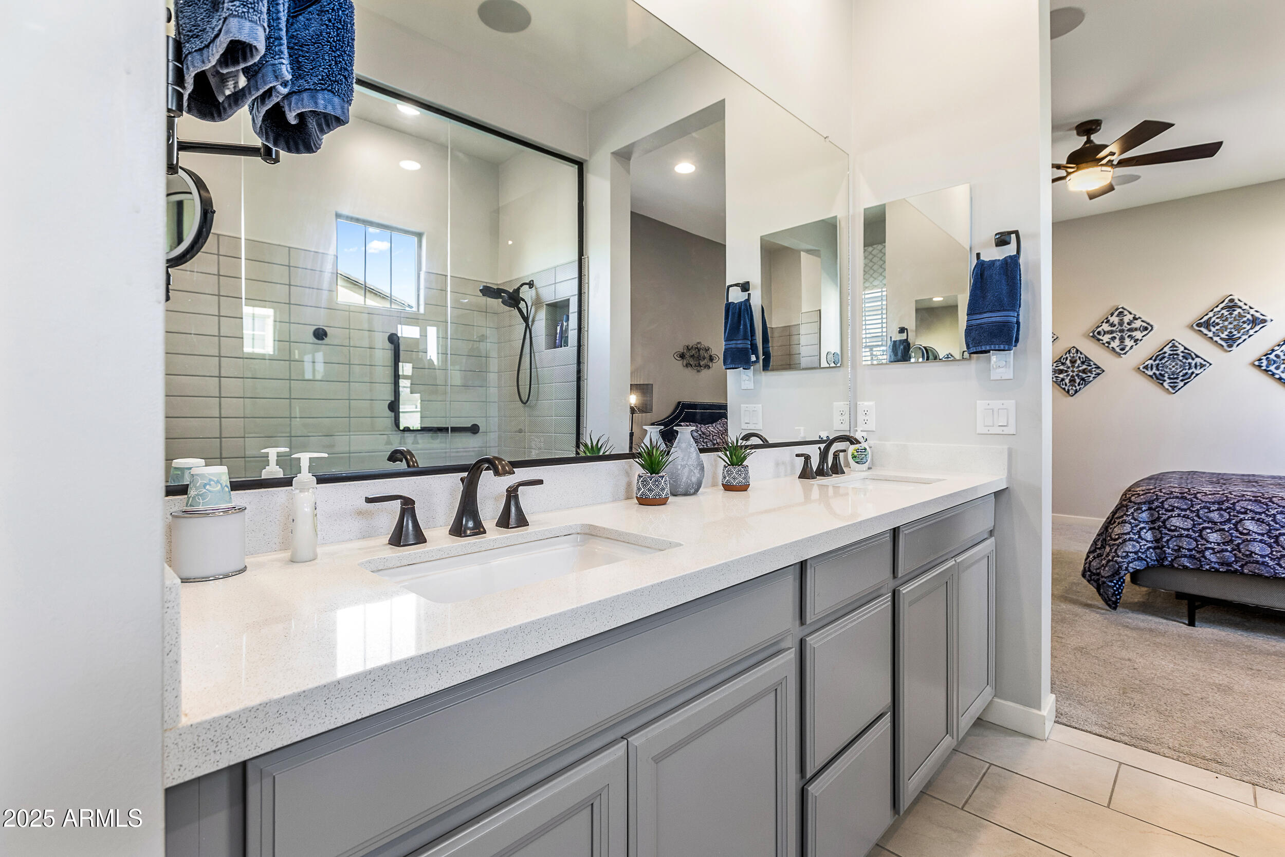23030 East Estrella Road Queen Creek, AZ 85142 - Photo 33 of 47 a bathroom with a double vanity sink mirror and shower