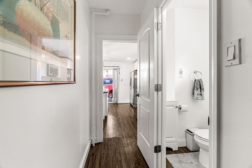 24 Hooper Street Chelsea, MA 02150 - Photo 12 of 15 a bathroom with a granite countertop toilet and a shower