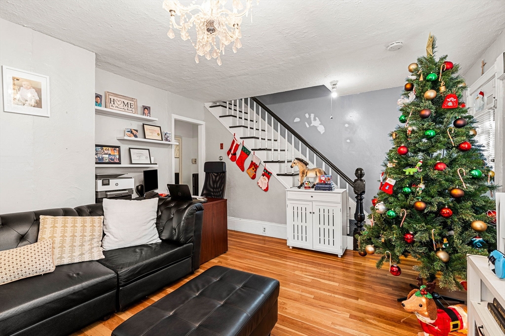 24 Hooper Street Chelsea, MA 02150 - Photo 15 of 15 a room with furniture and flowers