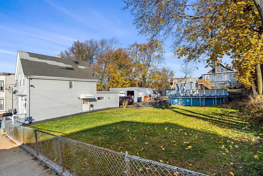 24 Hooper Street Chelsea, MA 02150 - Photo 2 of 15 a view of a swimming pool with an outdoor space and seating area