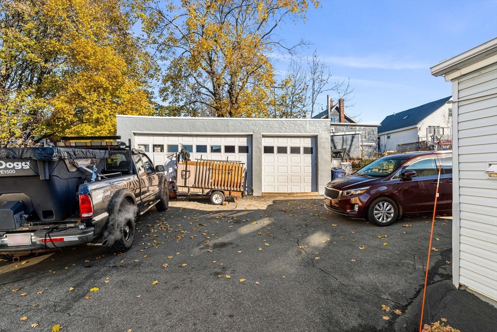24 Hooper Street Chelsea, MA 02150 - Photo 4 of 15 a car parked in front of a house