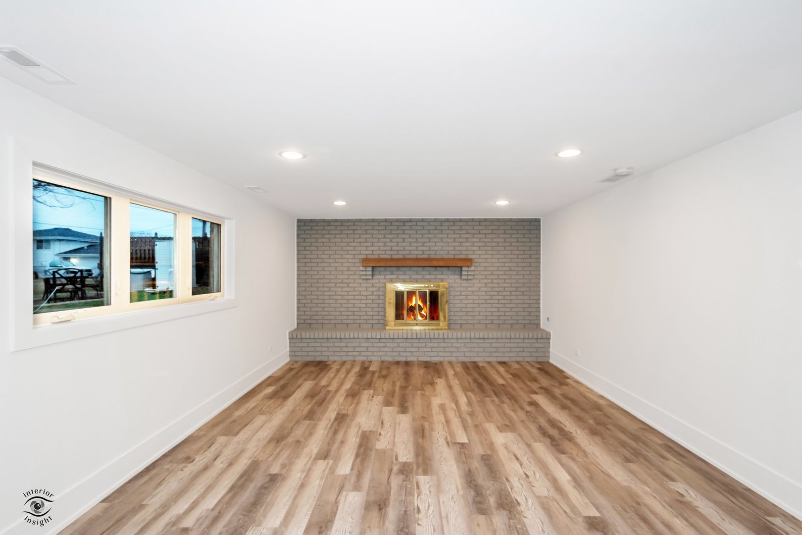 Undisclosed Address Lansing, IL 60438 - Photo 11 of 23 a view of an empty room with wooden floor and a window