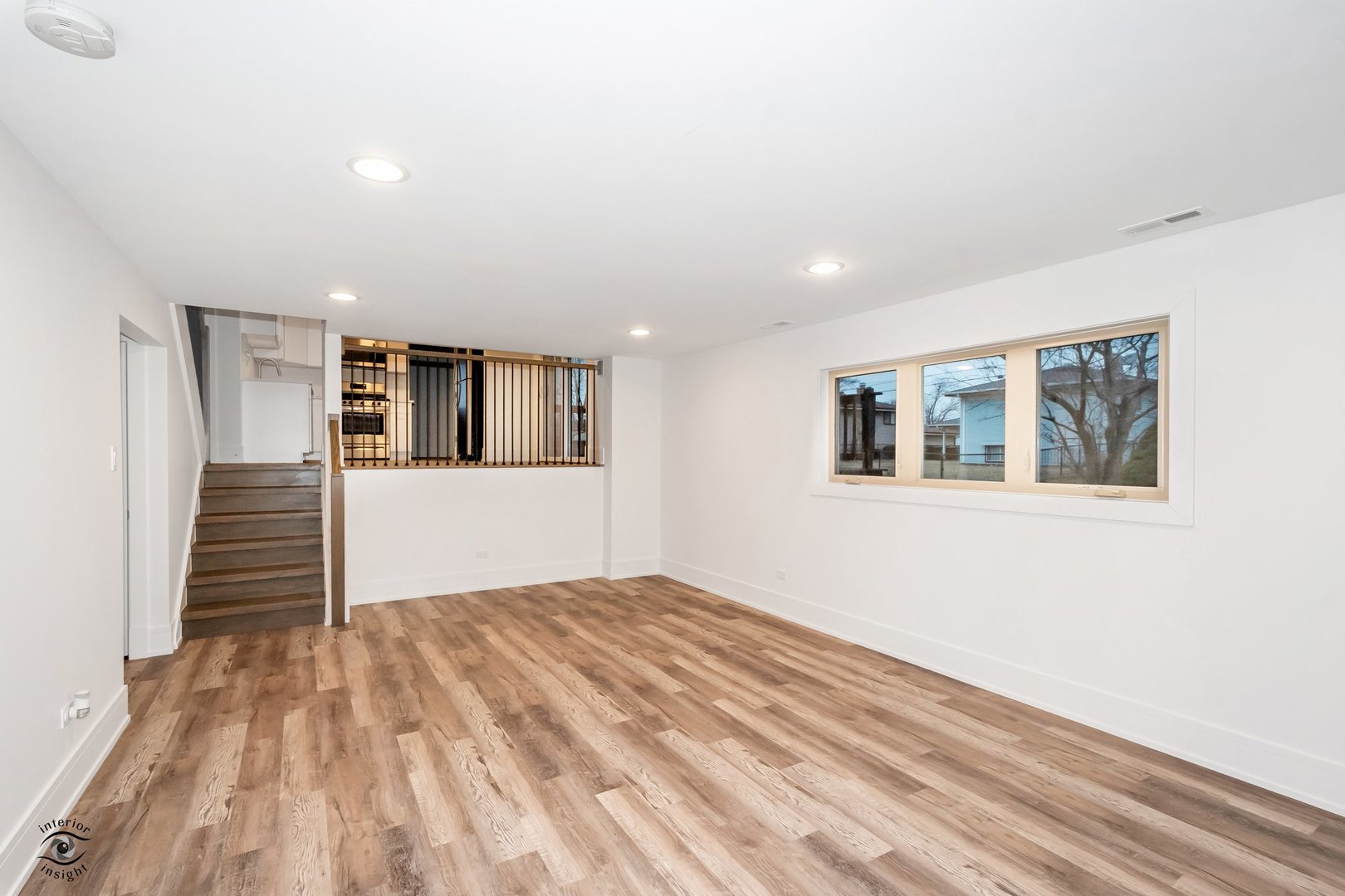 Undisclosed Address Lansing, IL 60438 - Photo 12 of 23 a view of empty room with wooden floor and stairs