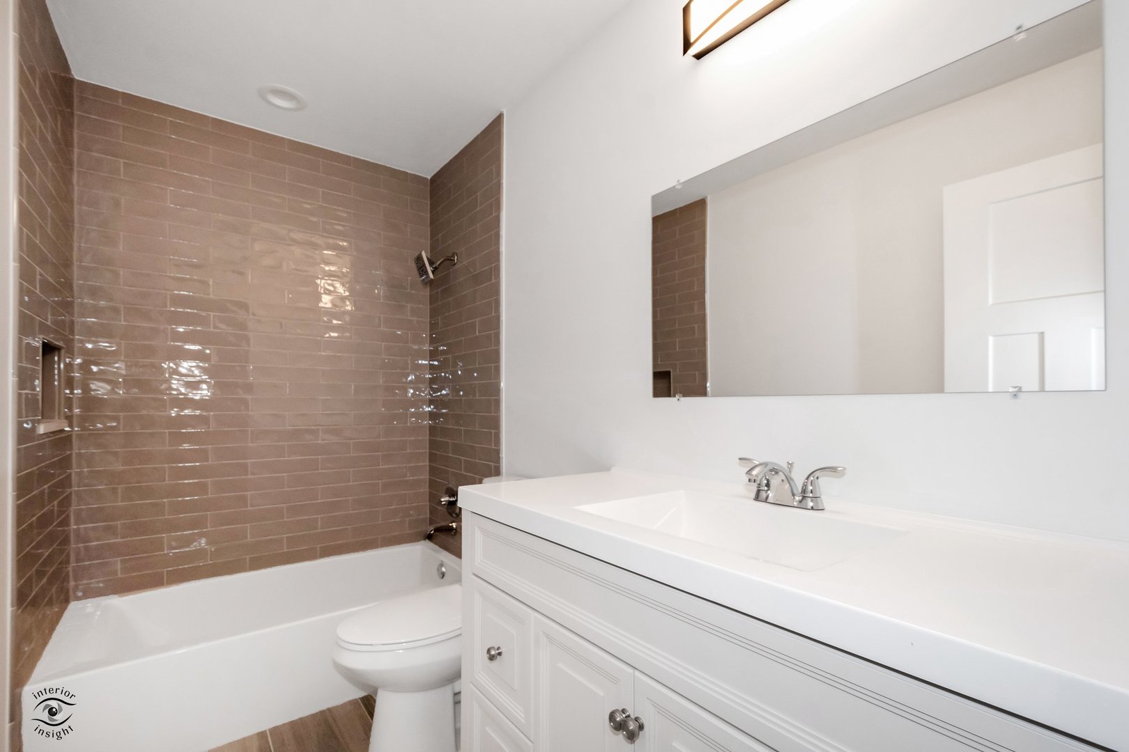 Undisclosed Address Lansing, IL 60438 - Photo 16 of 23 a bathroom with a sink a toilet and shower