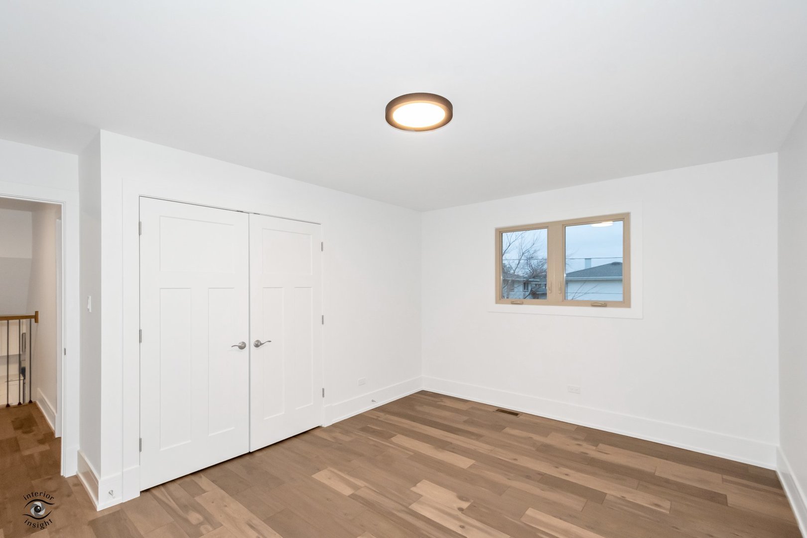 Undisclosed Address Lansing, IL 60438 - Photo 17 of 23 a view of a room with wooden floor and window