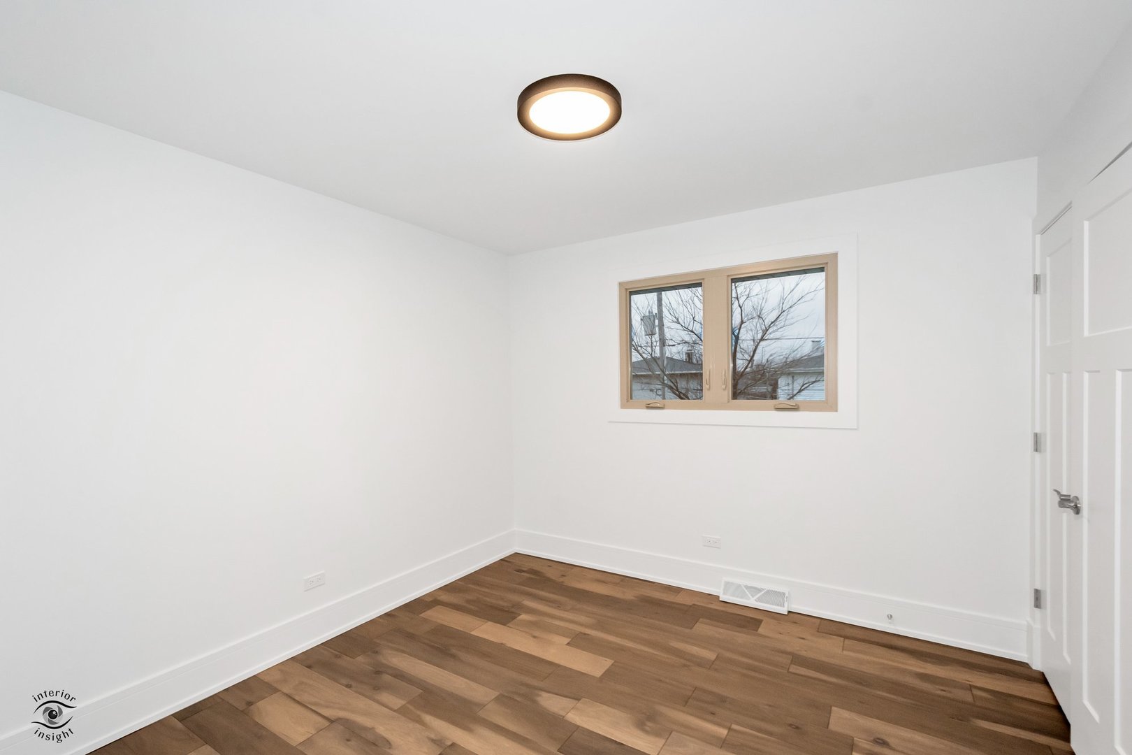Undisclosed Address Lansing, IL 60438 - Photo 18 of 23 a view of a room with wooden floor and window
