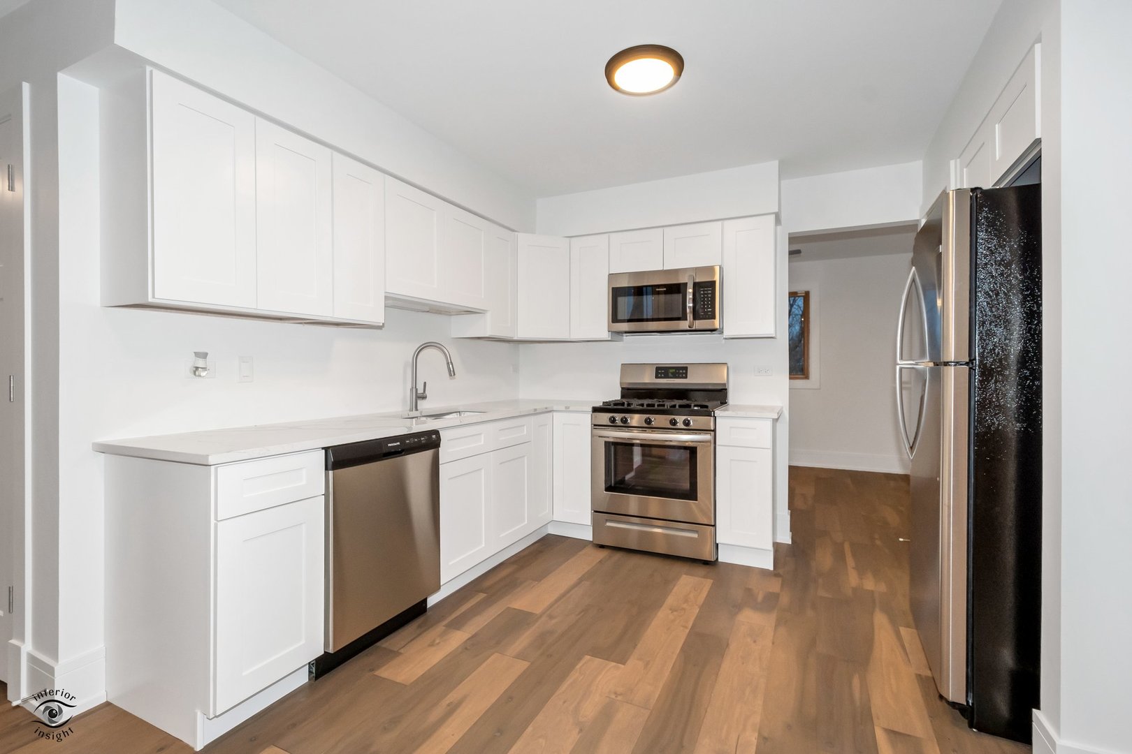Undisclosed Address Lansing, IL 60438 - Photo 3 of 23 a kitchen with a refrigerator stove and sink