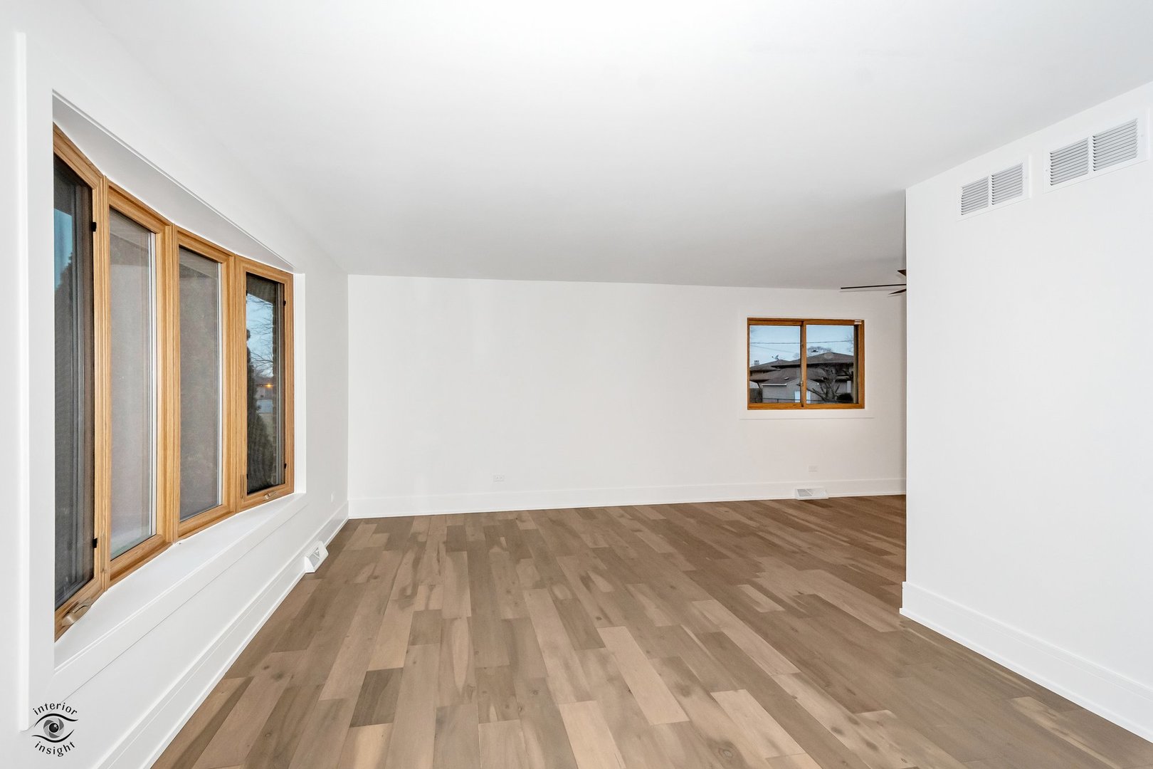 Undisclosed Address Lansing, IL 60438 - Photo 8 of 23 a view of a big room with wooden floor and windows