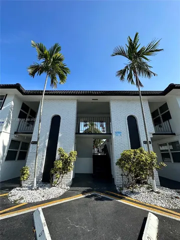 a room with window and flowerpot