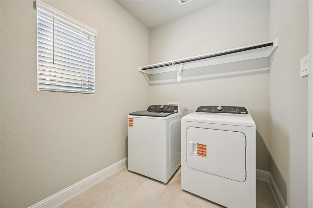 505 Stagg Street McKinney, TX 75069 - Photo 19 of 39 a utility room with dryer and washer