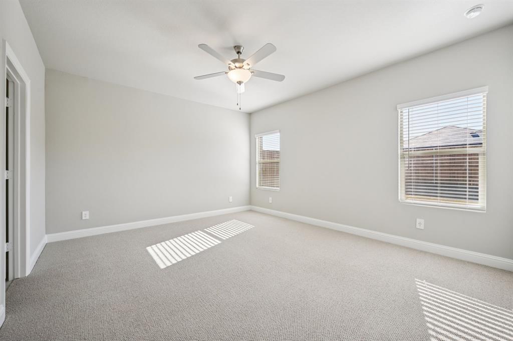 505 Stagg Street McKinney, TX 75069 - Photo 20 of 39 an empty room with windows and fan
